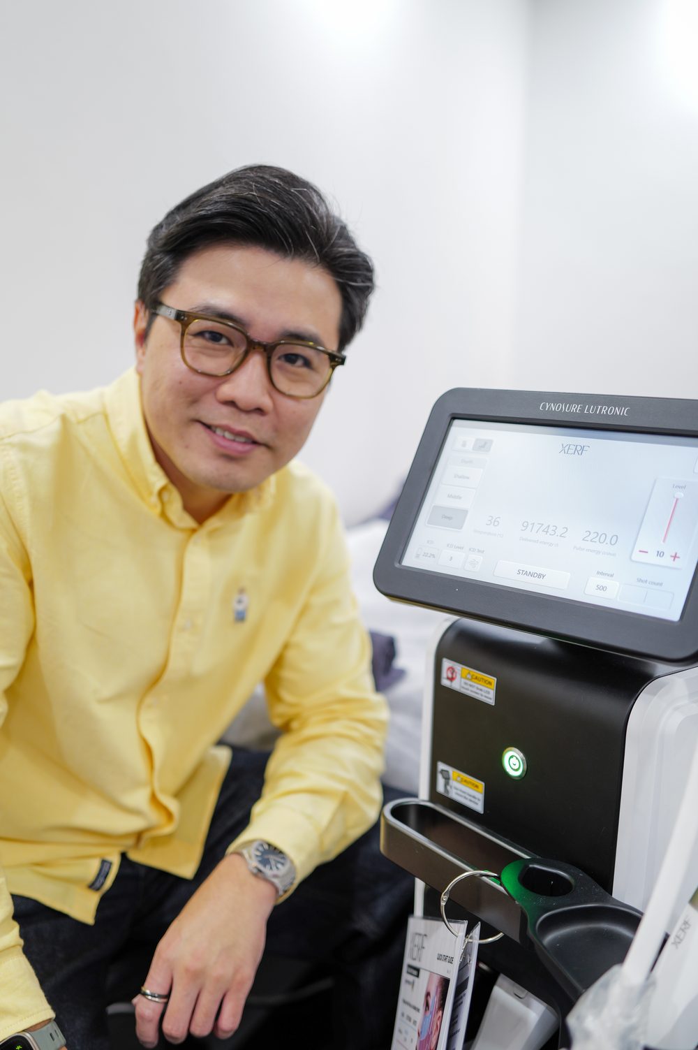 Dr Ong Jin Khang beside the XERF console overseas in March 2026, the first Malaysian doctor treated with XERF and to perform it, before its Malaysian launch.